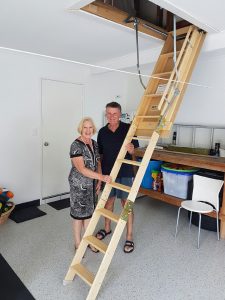 Couple and Attic Ladder.