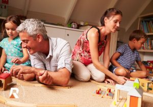 family playing in attic room