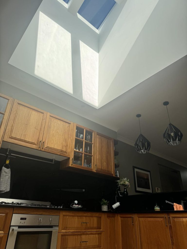 Roof window skylight bringing daylight into kitchen